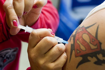 A patient is injected with flu vaccine on Wednesday. © 2011 Gallup Independent / Brian Leddy 